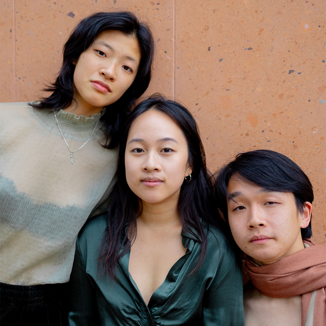 Photo of Anna Zheng, Junah Jang, and Eli Shi from the Three Fools Collective (2023-24 IDA Fellows)